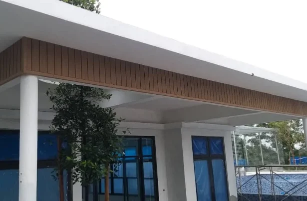 Showcase of composite wood wall cladding used as part of the roofing renovation house